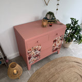 Colourful pink retro chest of drawers with florals