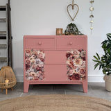 Colourful pink retro chest of drawers with florals