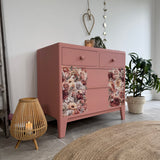 Colourful pink retro chest of drawers with florals