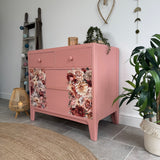 Colourful pink retro chest of drawers with florals
