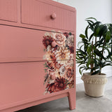 Colourful pink retro chest of drawers with florals