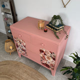 Colourful pink retro chest of drawers with florals