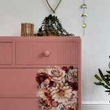 Colourful pink retro chest of drawers with florals