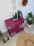Bright pink and floral vintage bow fronted chest of drawers
