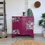 Bright pink and floral vintage bow fronted chest of drawers
