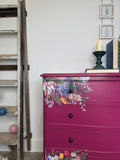 Bright pink and floral vintage bow fronted chest of drawers