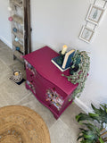 Bright pink and floral vintage bow fronted chest of drawers