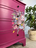 Bright pink and floral vintage bow fronted chest of drawers