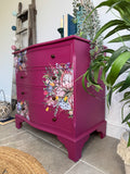 Bright pink and floral vintage bow fronted chest of drawers