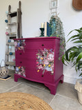 Bright pink and floral vintage bow fronted chest of drawers