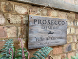 White washed rustic wooden ‘Prosecco’ wall sign