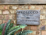 White washed rustic wooden ‘Prosecco’ wall sign